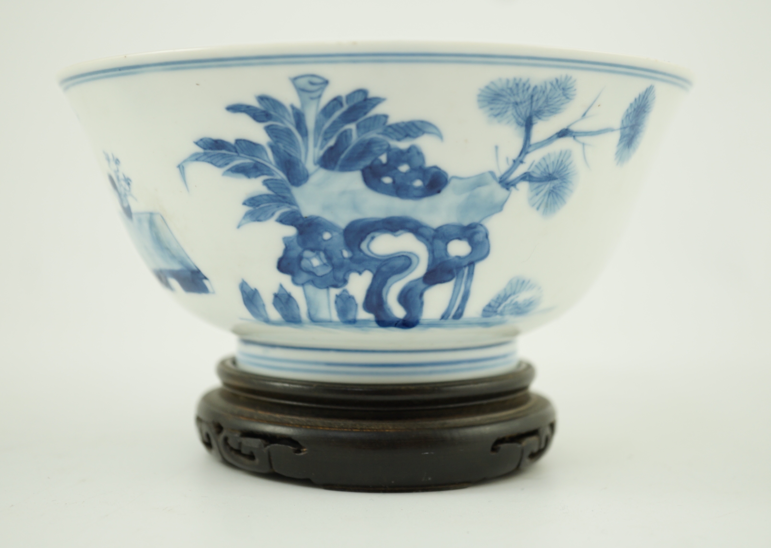 A Chinese blue and white ‘ladies’ bowl, Kangxi period, 15.5cm diameter, wood stand